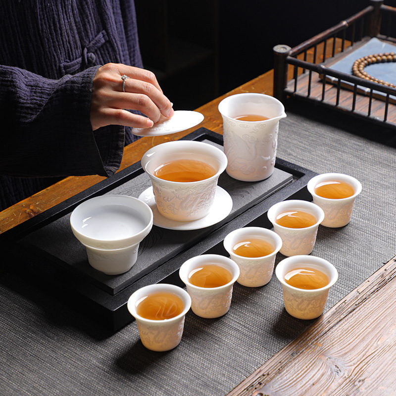 Dehua Ceramic Kung Fu Tea Set Complete Wholesale Longfeng Chengxiang embossed tea sets for household business activities