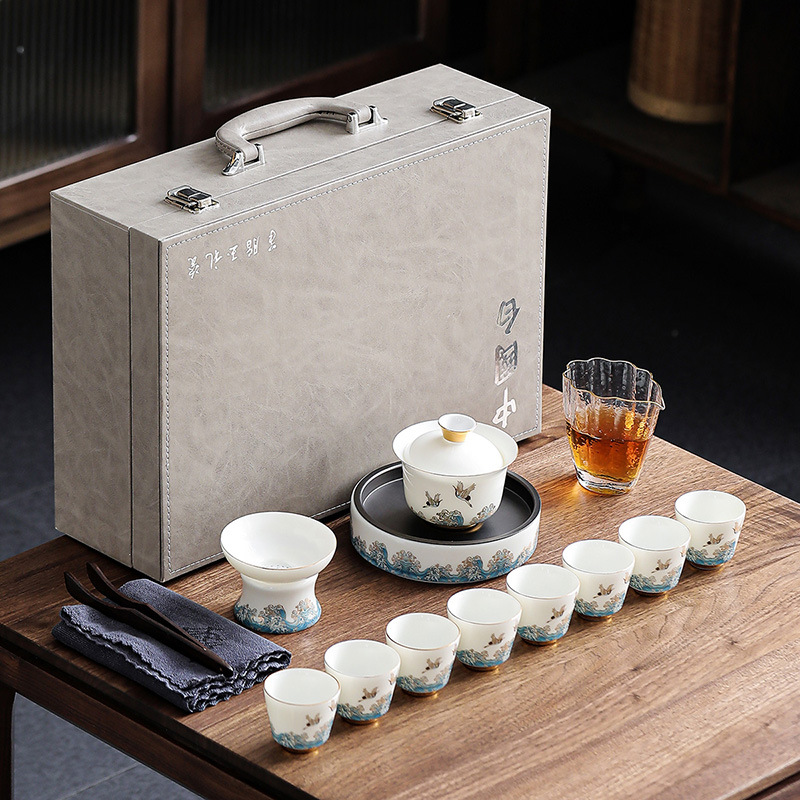 Dehua sheep fat jade kung fu tea set business household gold-painted ceramic tea cup cover bowl complete set with hand gift white porcelain